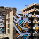 Image for article titled This incredible 50-building-wide street art honors Cairo’s trash pickers